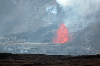 Lava erupting from vent in side of Halemaumau Crater with smoke (vog) rising. (Zoom view)